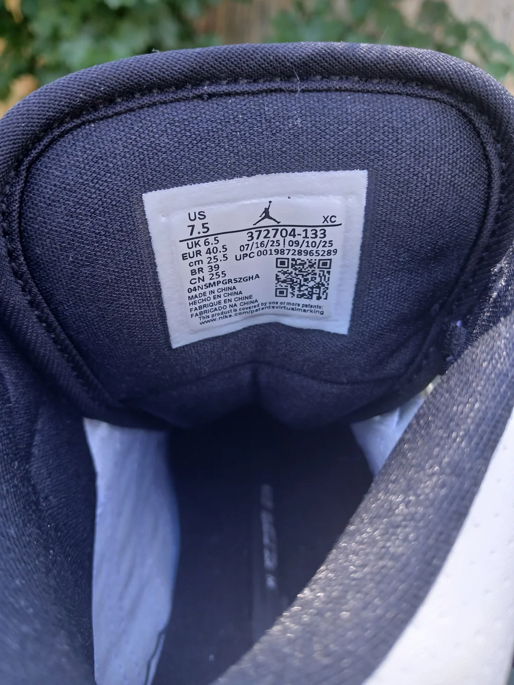Jordan Men’s White and Black Mid-Top Sneakers with Jumpman Logo